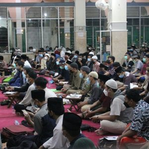 a group of people sitting outside